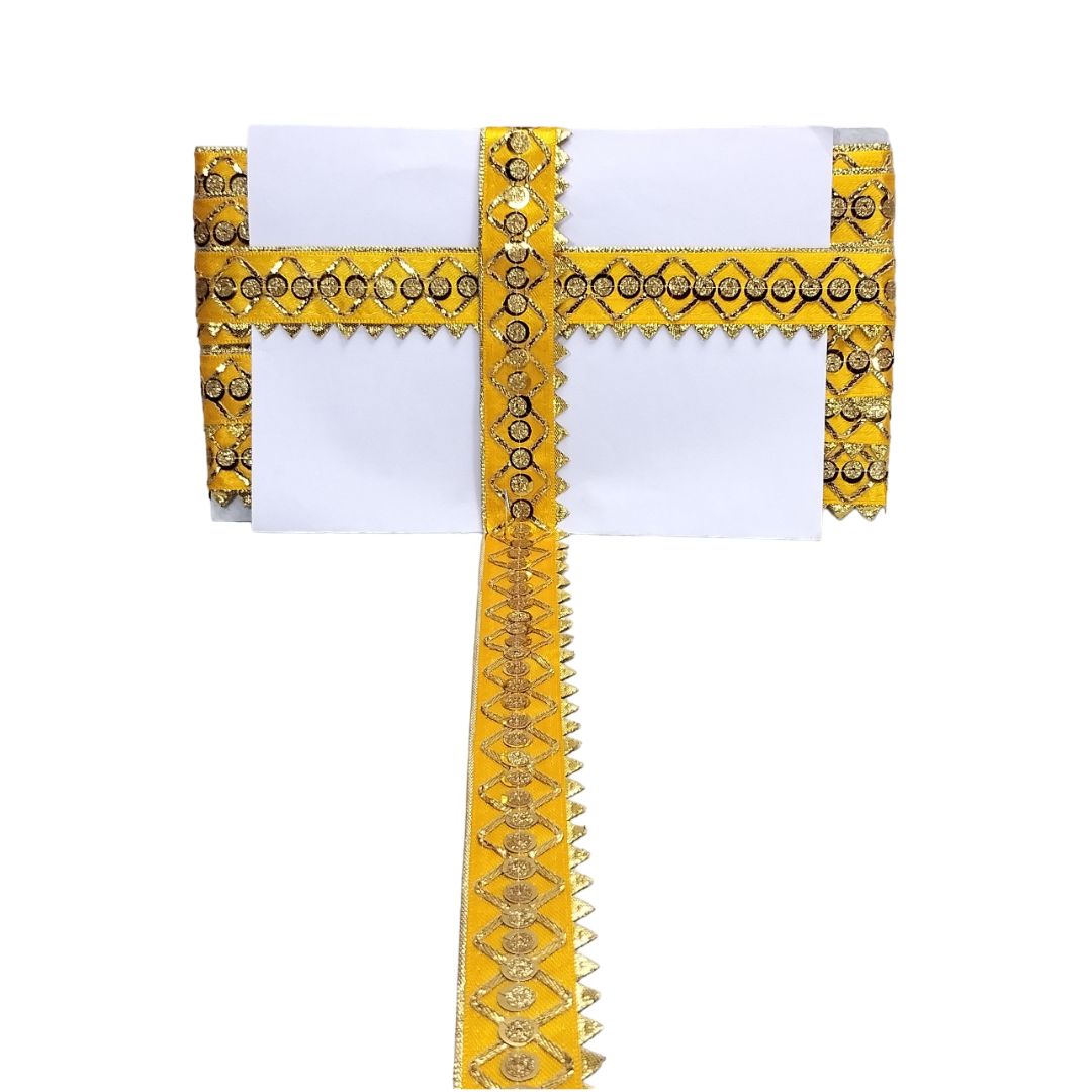 Decorative yellow and white fabric with intricate patterns on a white background