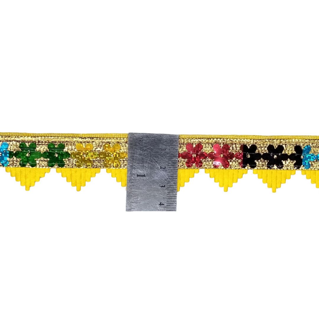 Decorative border with colorful beads and a metal ruler on a white background