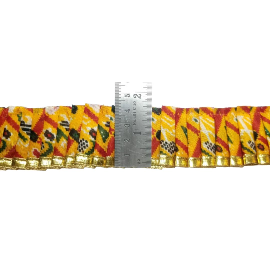 Decorative ribbon with a pattern and a ruler for measurement on a white background
