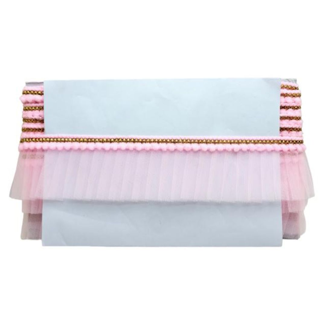 Stack of pink and white fabric with gold trim on a white background