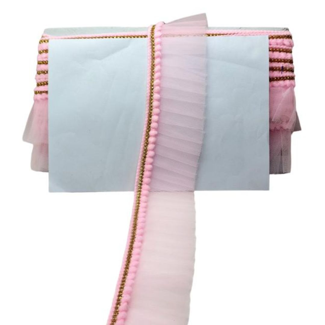 Pink and white fabric with gold trim on a white background