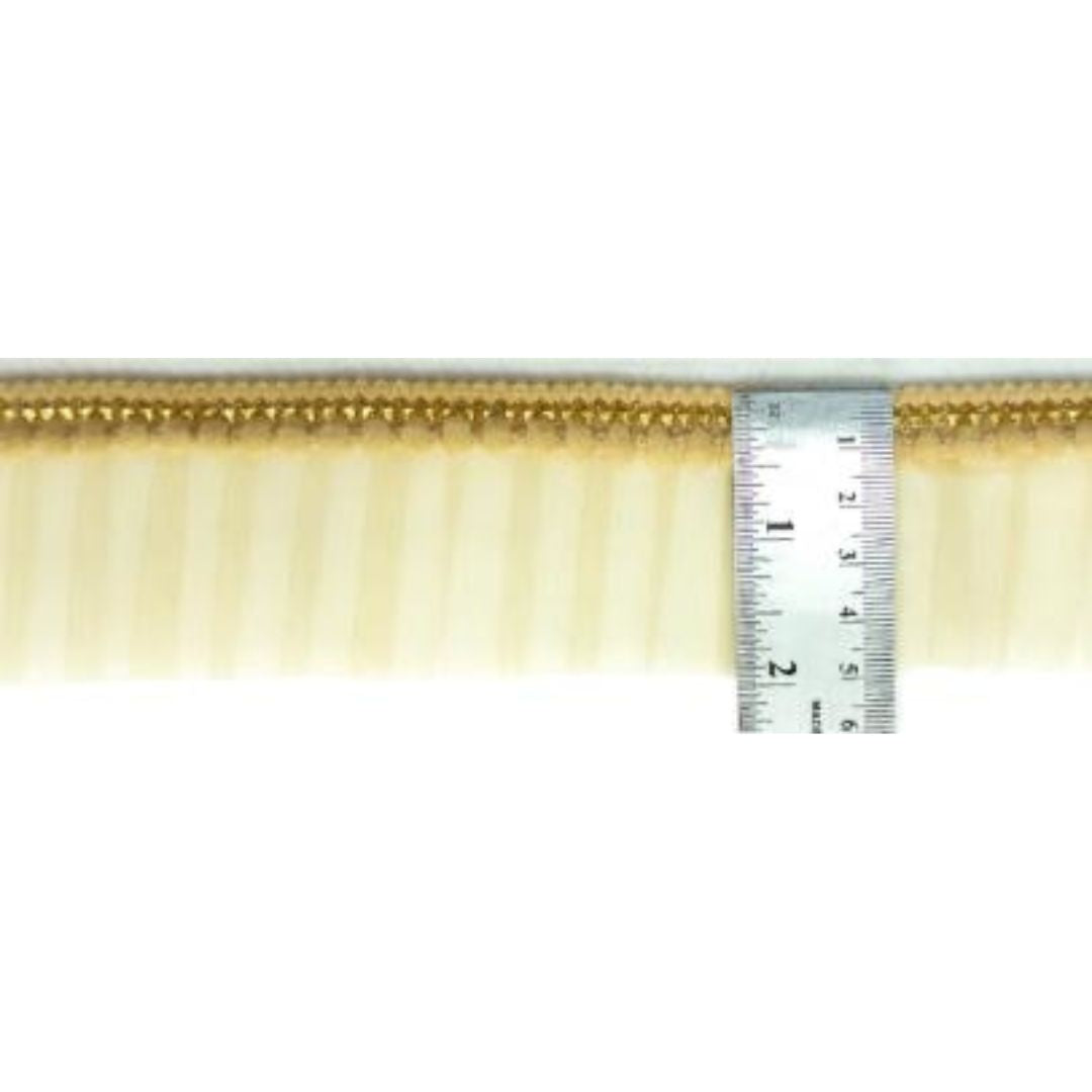 Decorative cornice with a ruler for scale on a white background