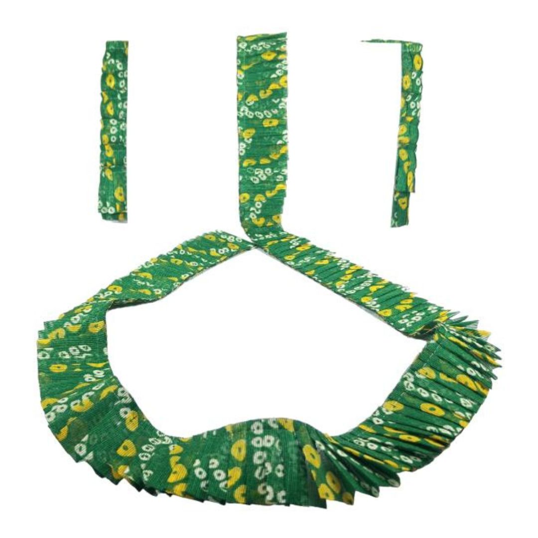Green and yellow patterned headband with decorative elements on a white background