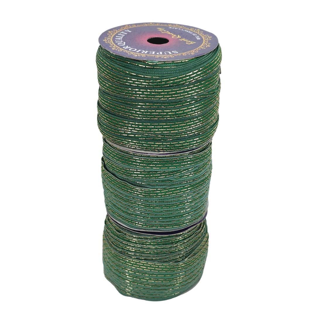 Spool of green thread on a white background