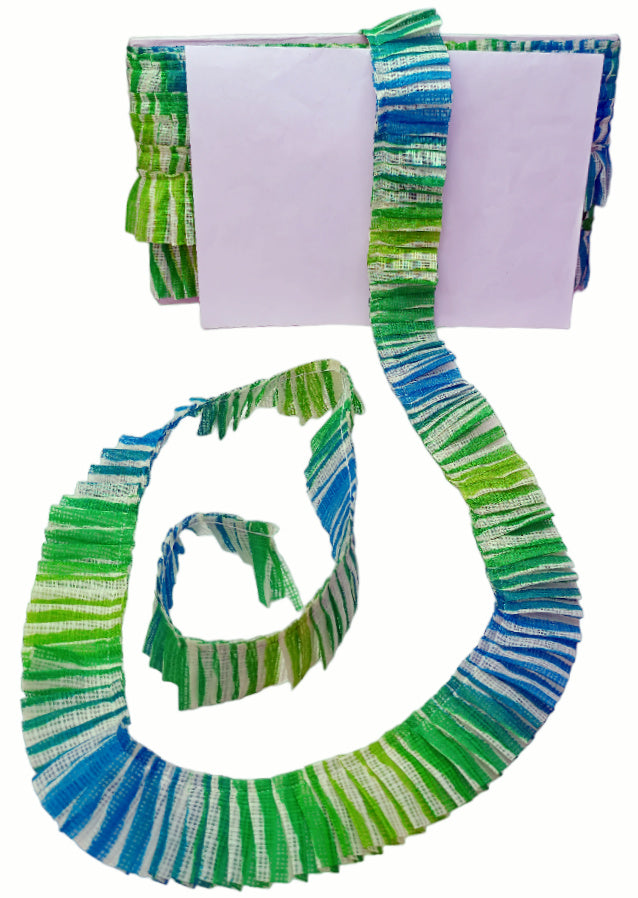 Colorful striped scarf with a matching pouch on a white background