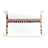 Decorative headboard with orange and brown pattern on a white background