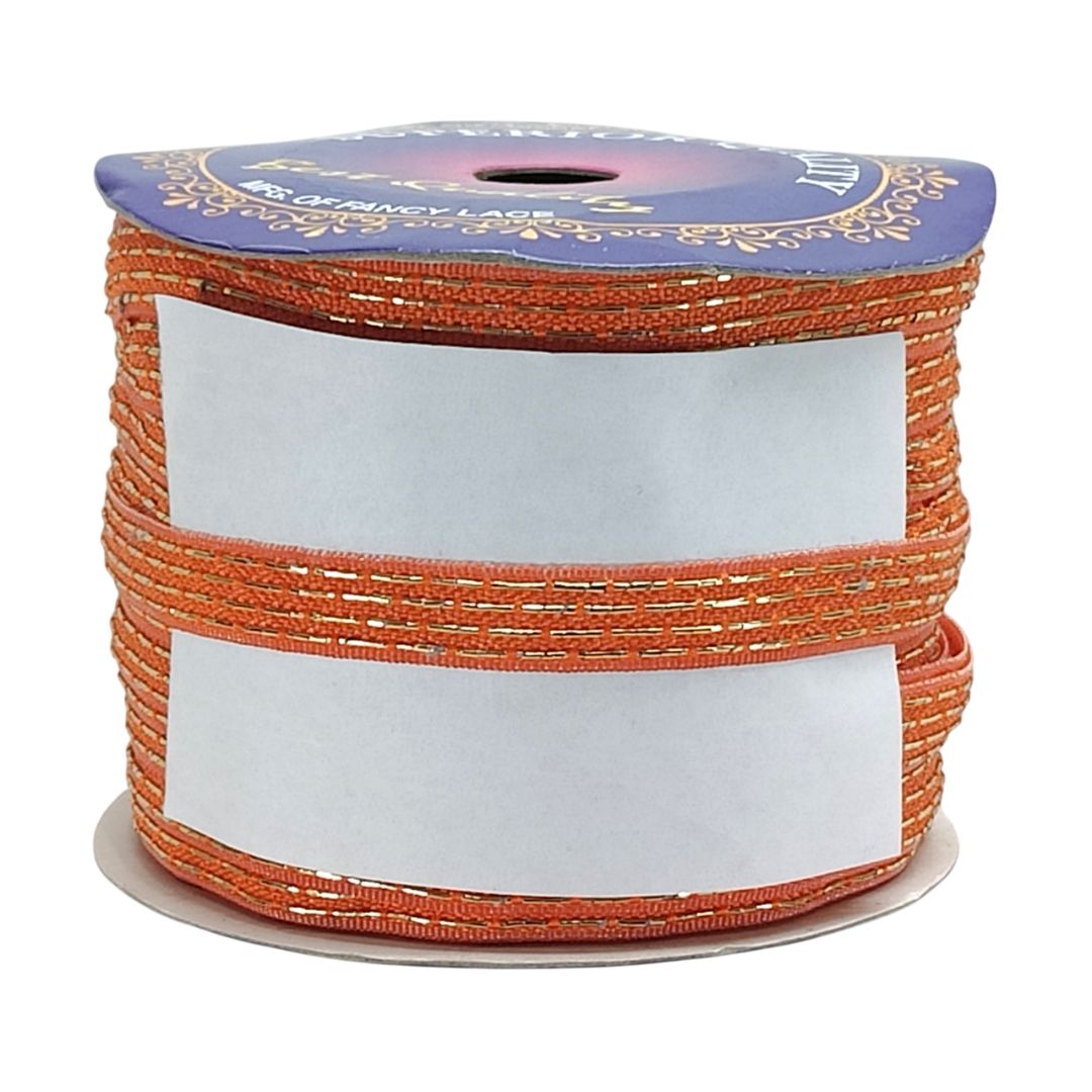Spool of orange ribbon with decorative blue label on a white background