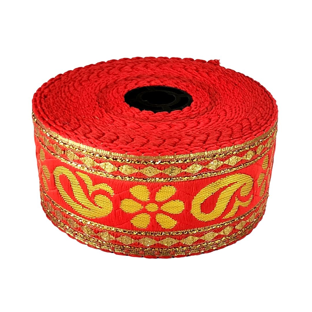Red ribbon with gold floral patterns on a white background