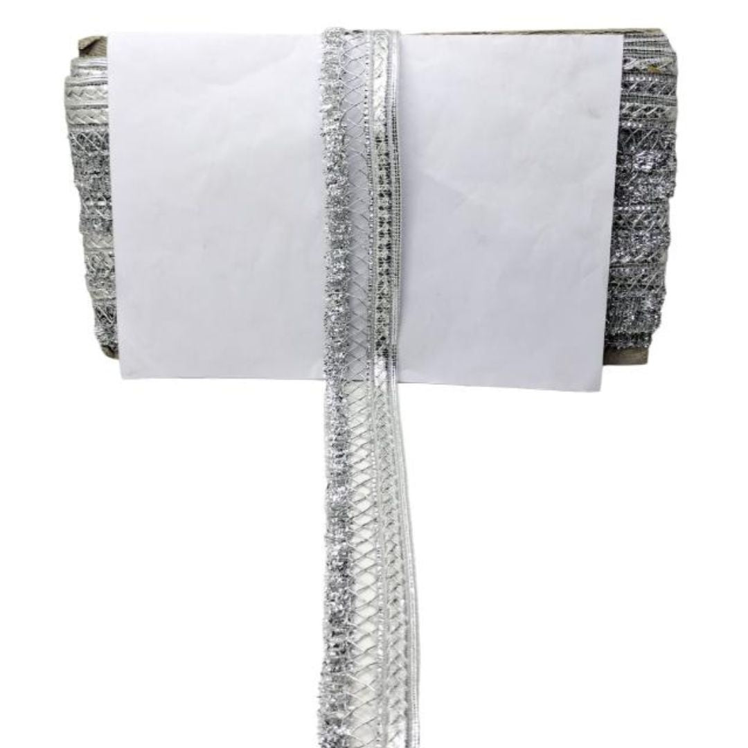 White fabric with silver trim on a white background