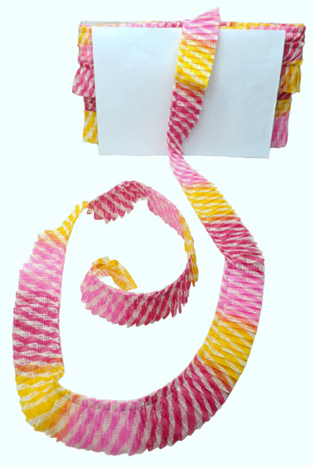 Colorful tie-dye hair scrunchie on a white background